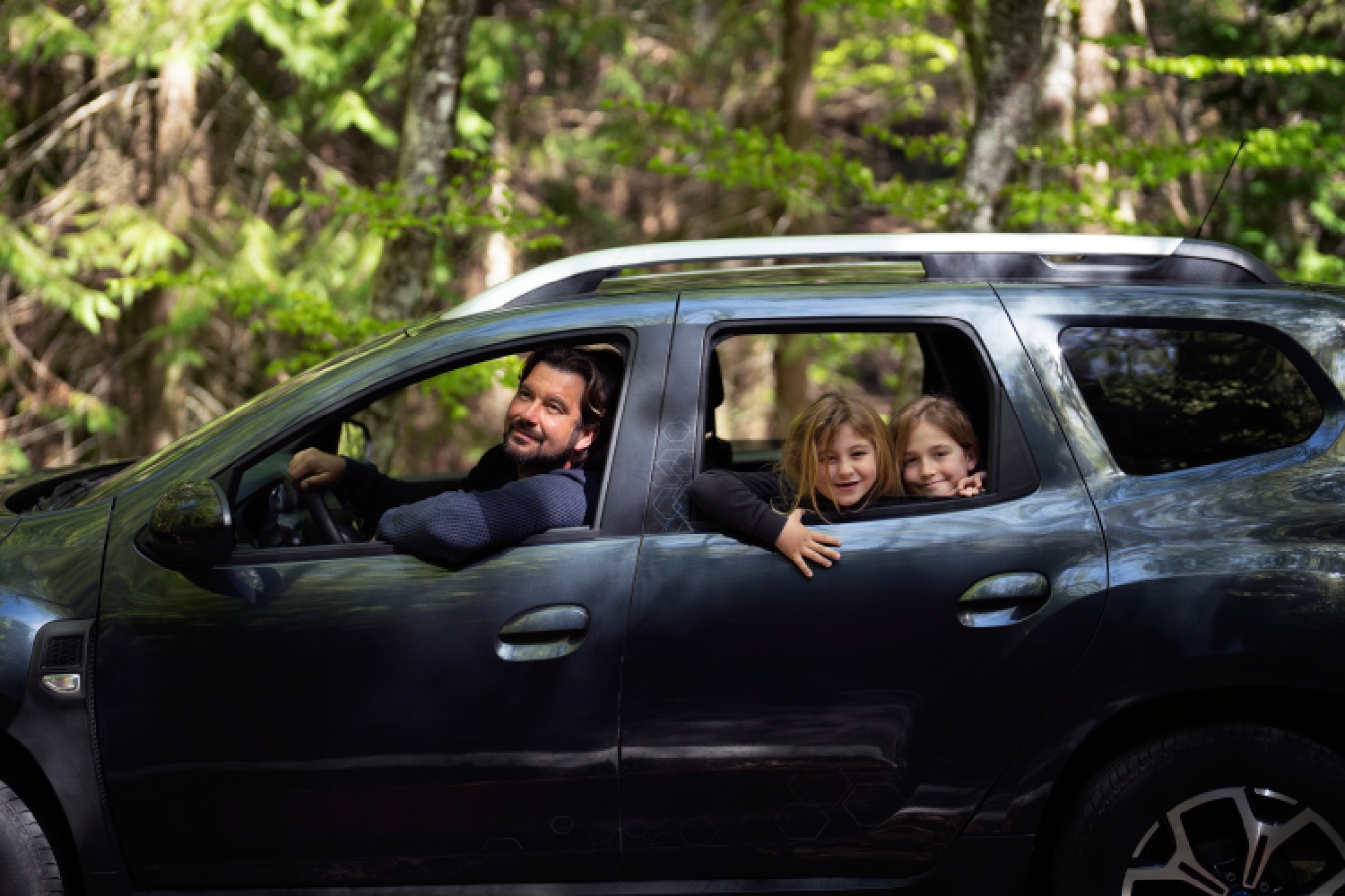 side-view-family-traveling-by-car